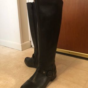 Knee high black leather. Side zipper and buckle.